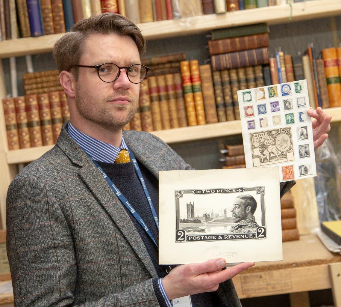 Hansons' Jim Spencer with some examples of stamp designs