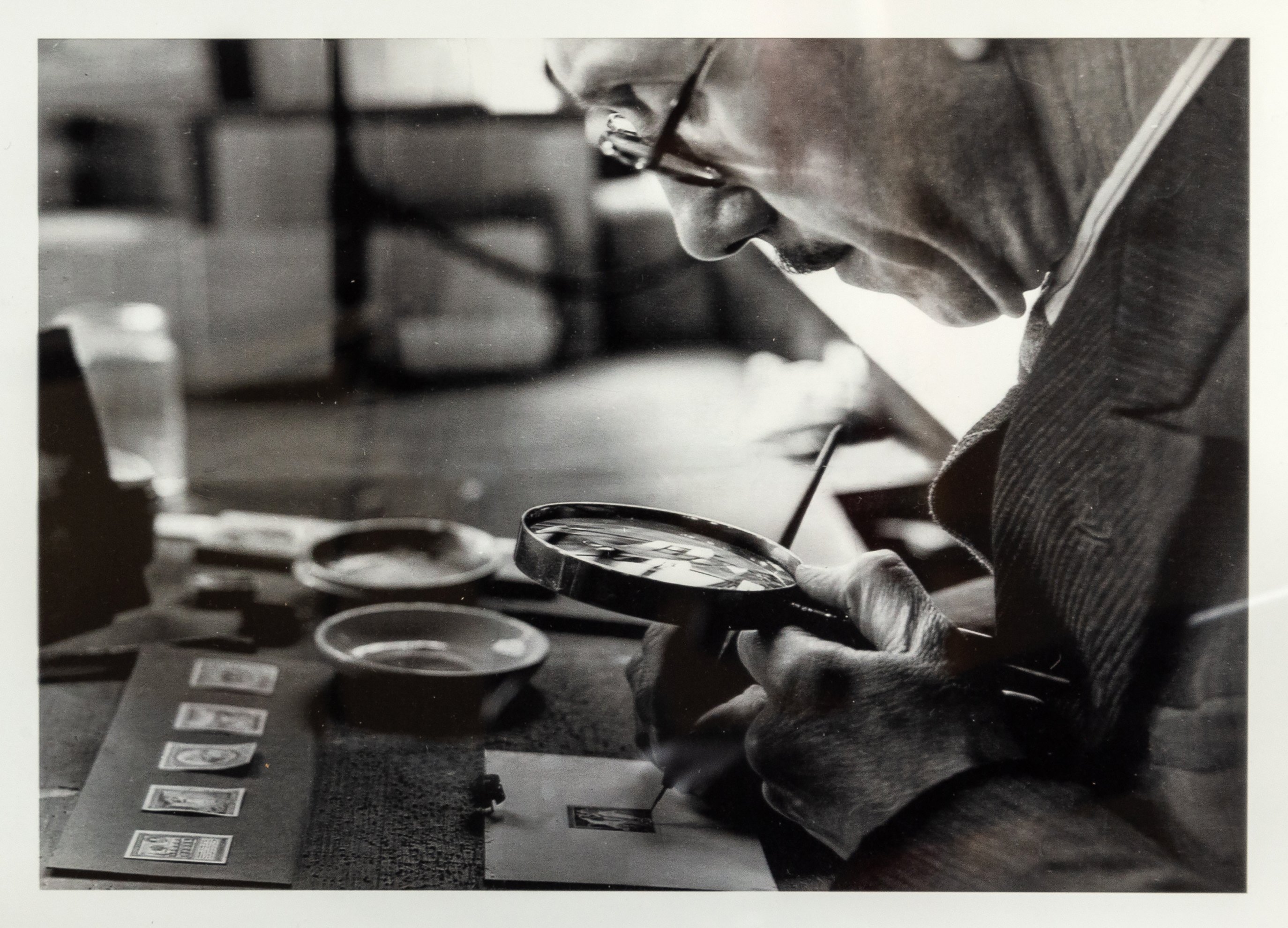 Leonard Fryer at work on a stamp design. Image: Hansons